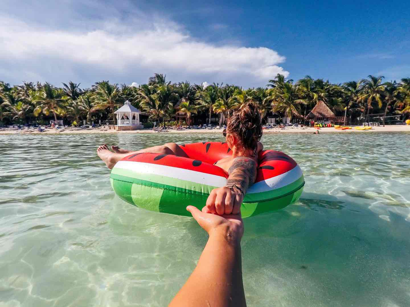 holding hands with girl on watermelon inflatable o 2022 11 16 19 06 57 utc